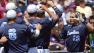 North Carolinas Brian Holberton (10) is greeted by teammates after hitting a two-run home run against LSU in the first inning of an NCAA College World Series elimination baseball game in Omaha, Neb., Tuesday, June 18, 2013.