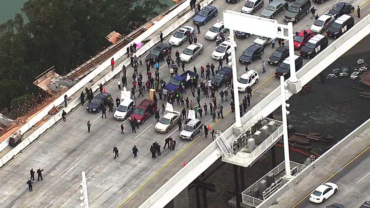 PHOTOS: Chained protesters block westbound traffic on Bay Bridge ...