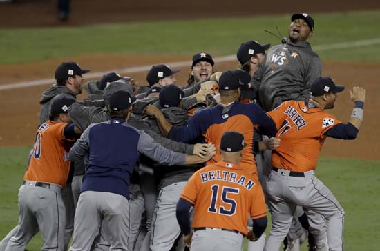<div class='meta'><div class='origin-logo' data-origin='AP'></div><span class='caption-text' data-credit='AP'>Members the the Houston Astros celebrate their win against the Los Angeles Dodgers in Game 7 of baseball's World Series. (AP Photo/Alex Gallardo)</span></div>