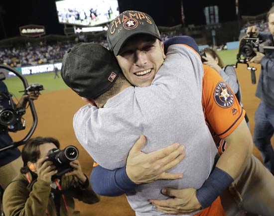 <div class='meta'><div class='origin-logo' data-origin='AP'></div><span class='caption-text' data-credit='AP'>Houston Astros' Jose Altuve and Alex Bregman celebrate after Game 7. (AP Photo/David J. Phillip)</span></div>