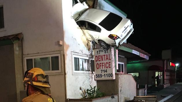Image result for Car soars into second floor of California building in bizarre crash; 2 hurt