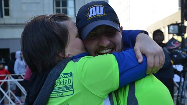 Carrie and Brent hug at the end of the race