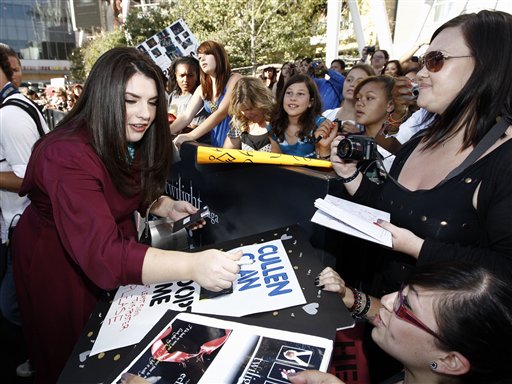 Stephenie Meyer signs autographs as she arrives at the premiere of 'The Twilight Saga: Eclipse' on Thursday, June 24, 2010 in Los Angeles.