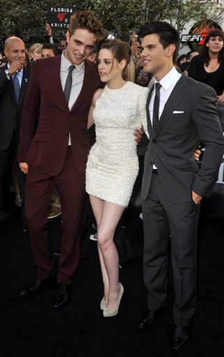 From left, Robert Pattinson, Kristen Stewart and Taylor Lautner arrive at the premiere of 'The Twilight Saga: Eclipse' on Thursday, June 24, 2010 in Los Angeles.